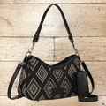 SugarBee's Western Boutique Wrangler black denim hobo bag with geometric embroidery, silver studs, and mini pouch.
