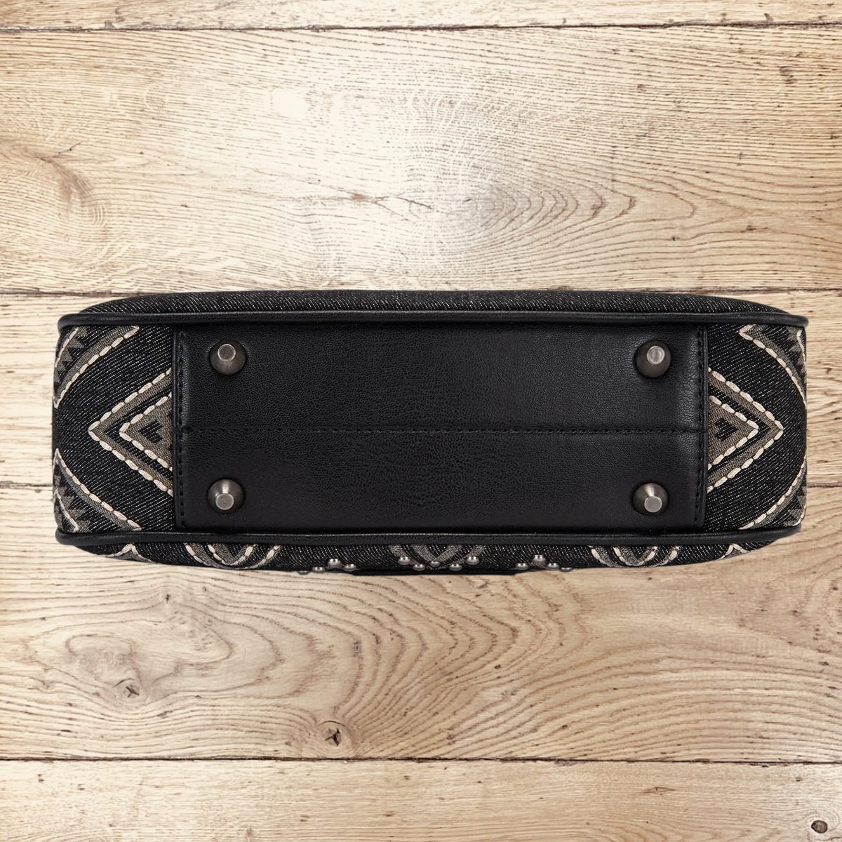 SugarBee's Western Boutique Wrangler black denim hobo bag bottom view with protective metal feet and embroidery