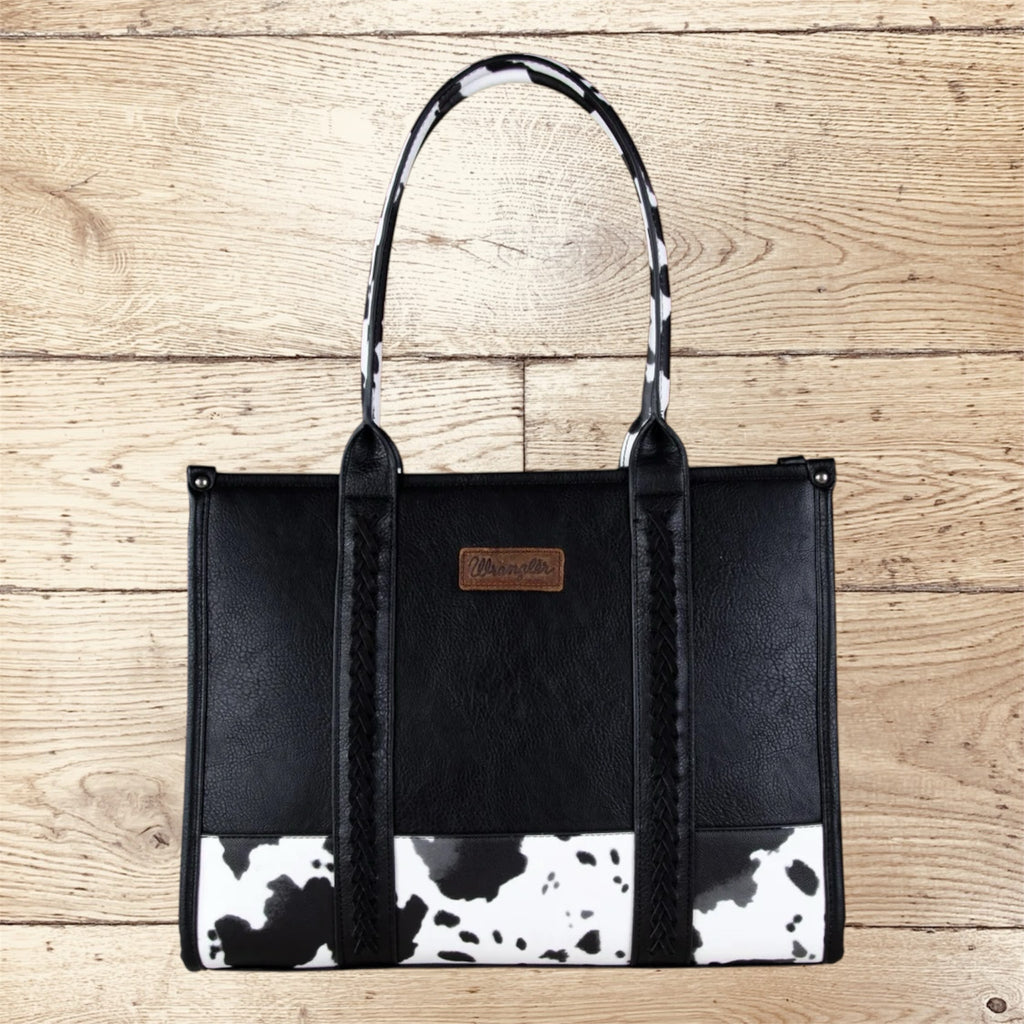 SugarBee's Western Boutique Wrangler black faux leather tote with cow-print base and matching shoulder straps.